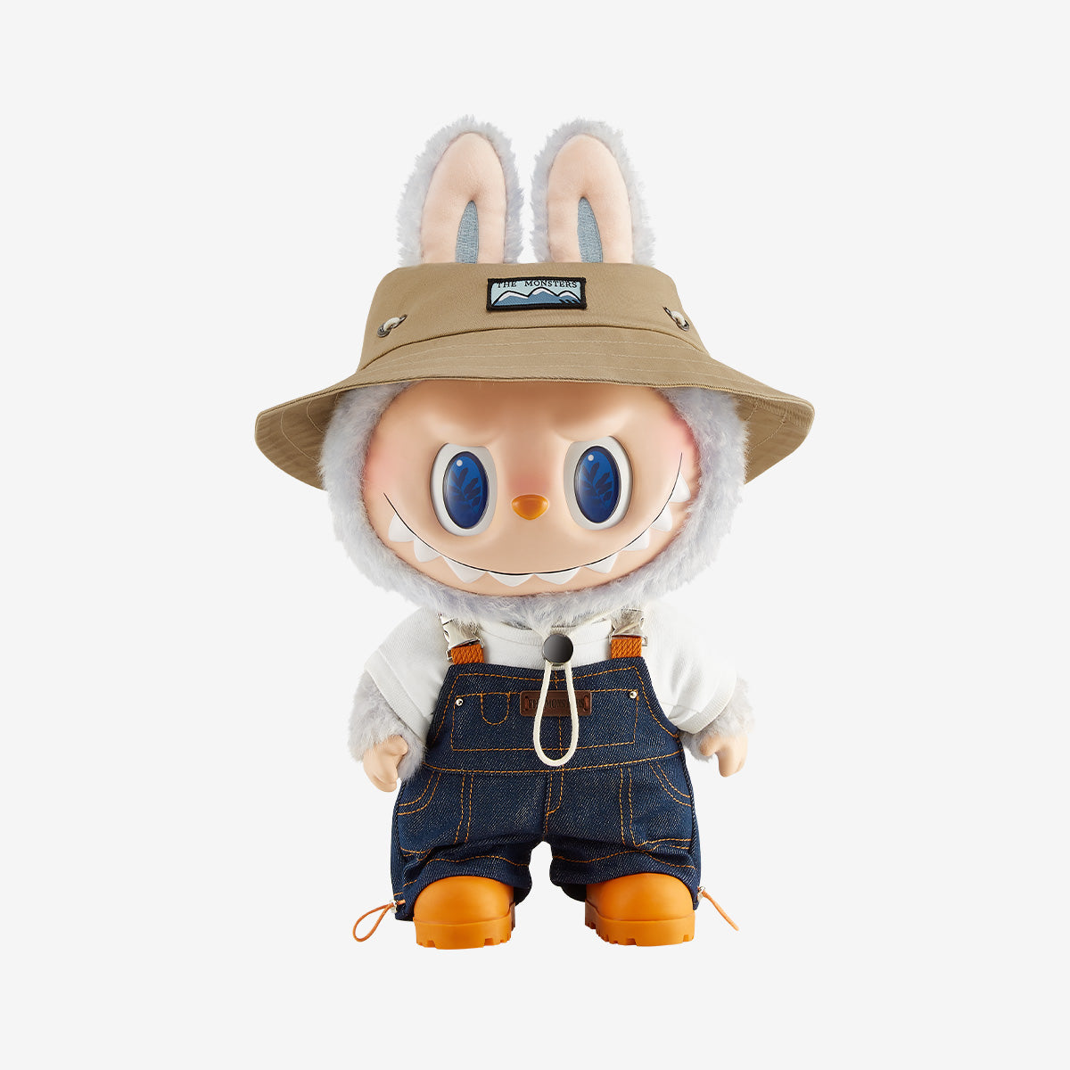 Plush toy with rabbit-like design wearing a beige hat, white shirt, blue shorts, and orange shoes on a white background.