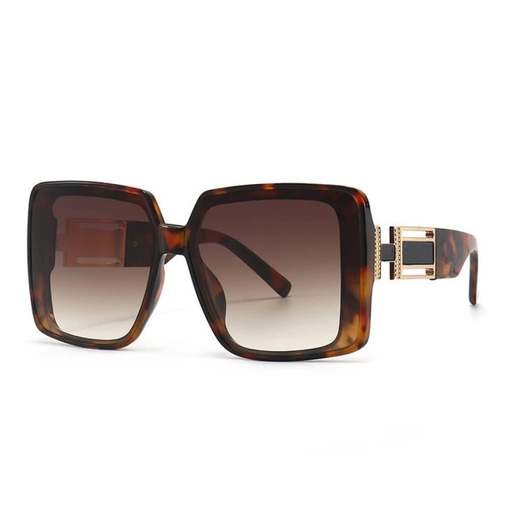 Sunglasses with tortoiseshell frame and gradient lenses on a white background